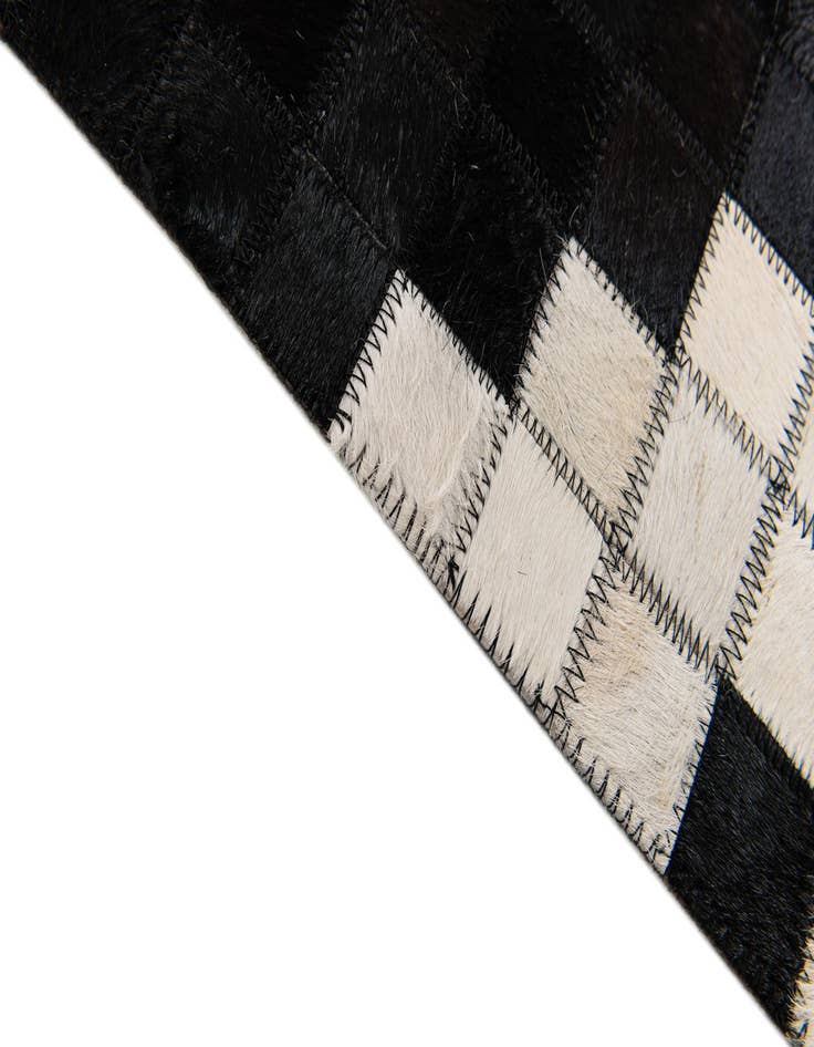 Detail image of  5' 1 x 8' Cowhide Stocks Rug