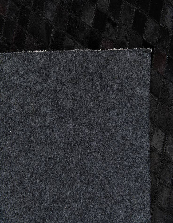 Detail image of  5' 2 x 8' Cowhide Stocks Rug