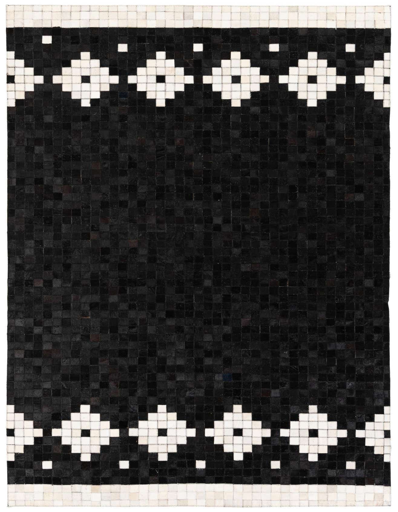 A 5x8 rectangular black cowhide rug with a modern geometric pattern of white diamond shapes bordering the top and bottom edges.