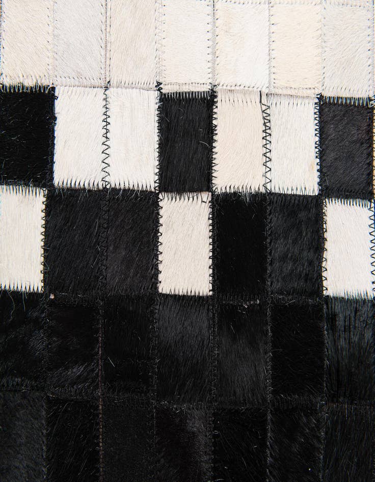 Detail image of  5' 2 x 8' Cowhide Stocks Rug