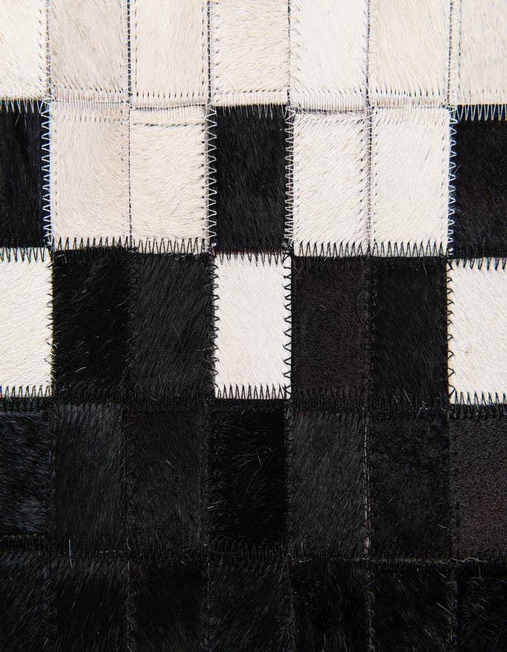 Detail image of  5' x 7' 11 Cowhide Stocks Rug