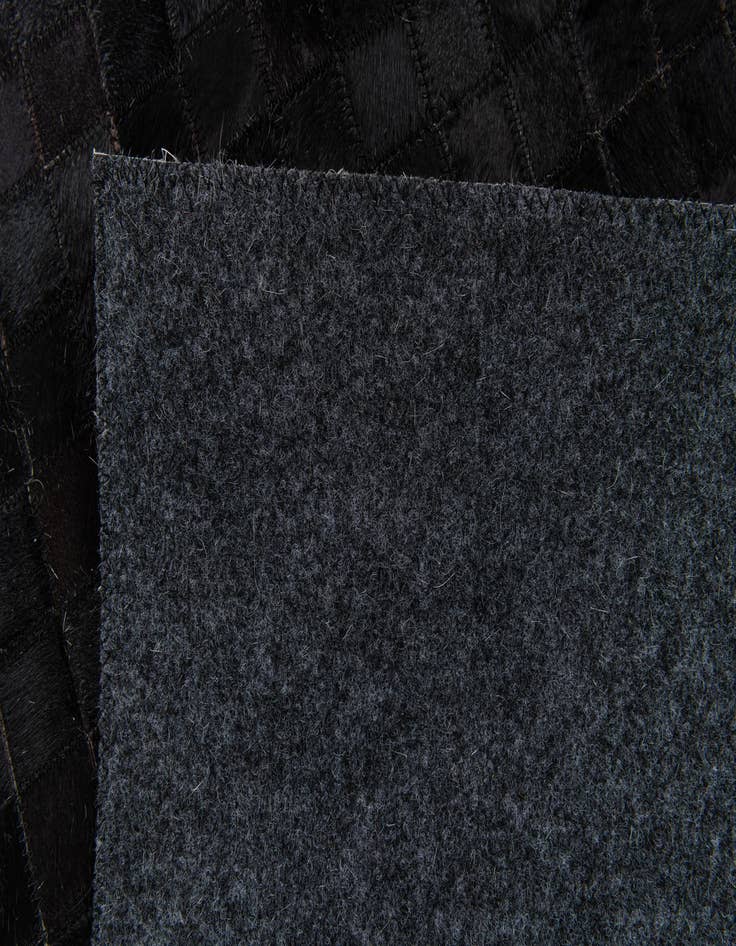 Detail image of  5' x 7' 11 Cowhide Stocks Rug