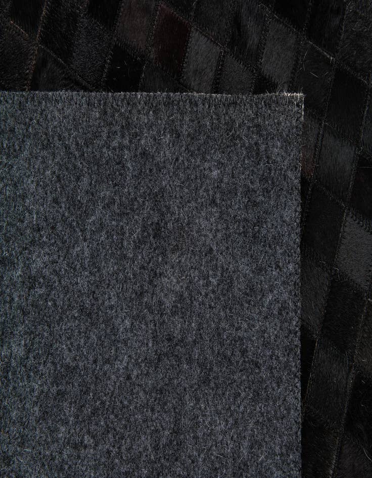 Detail image of  5' x 7' 11 Cowhide Stocks Rug