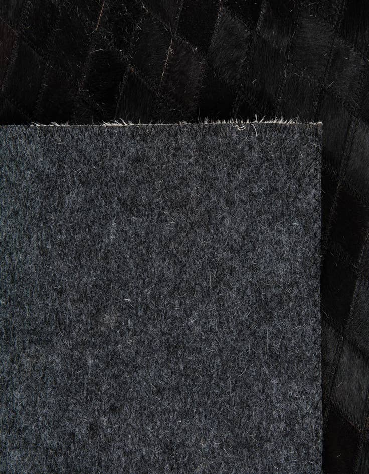 Detail image of  5' x 7' 11 Cowhide Stocks Rug