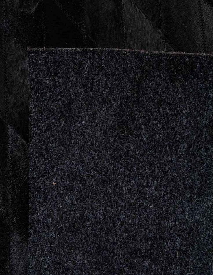 Detail image of  6' 6 x 9' 10 Cowhide Stocks Rug