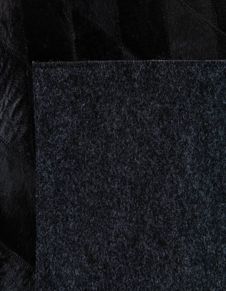 Detail image of  6' 5 x 9' 8 Cowhide Stocks Rug