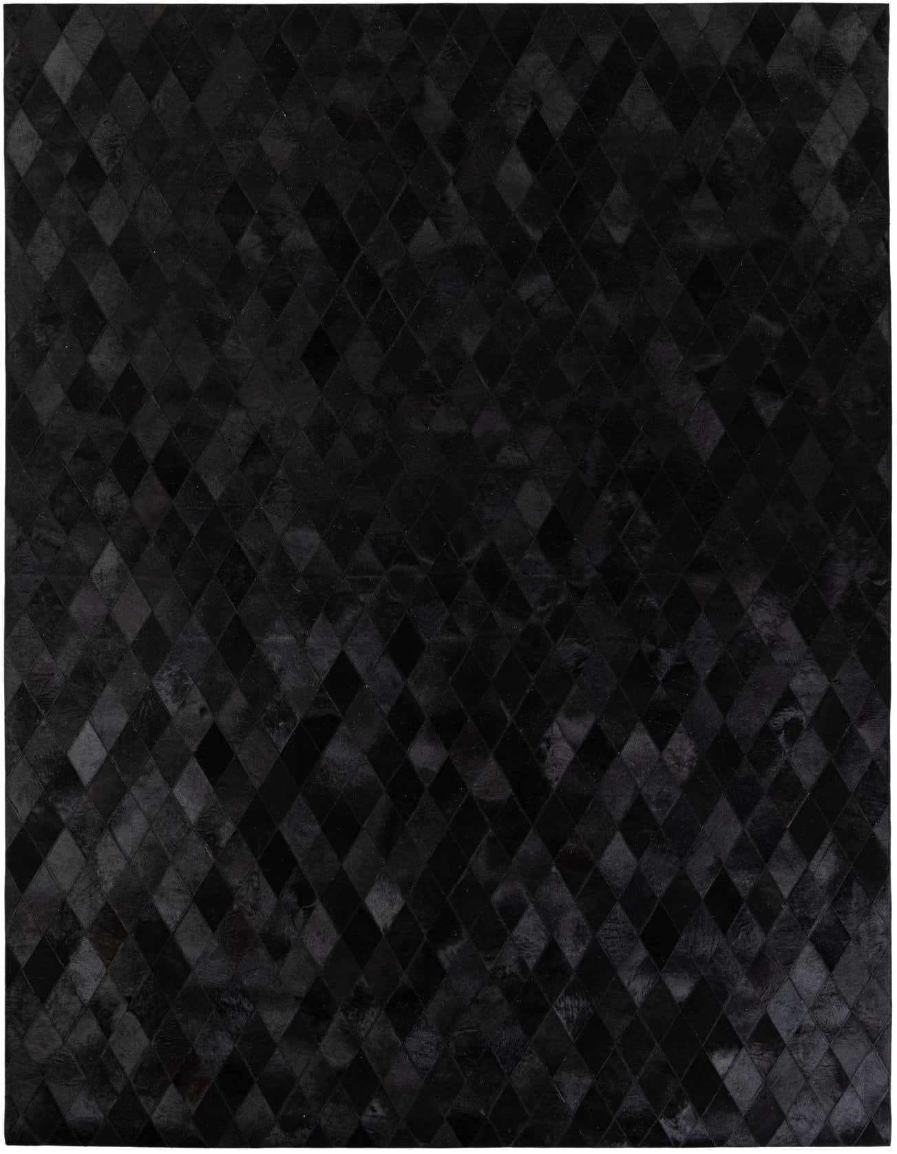 A 7x10 rectangular black patchwork rug made from cowhide and leather, featuring a geometric diamond pattern.
