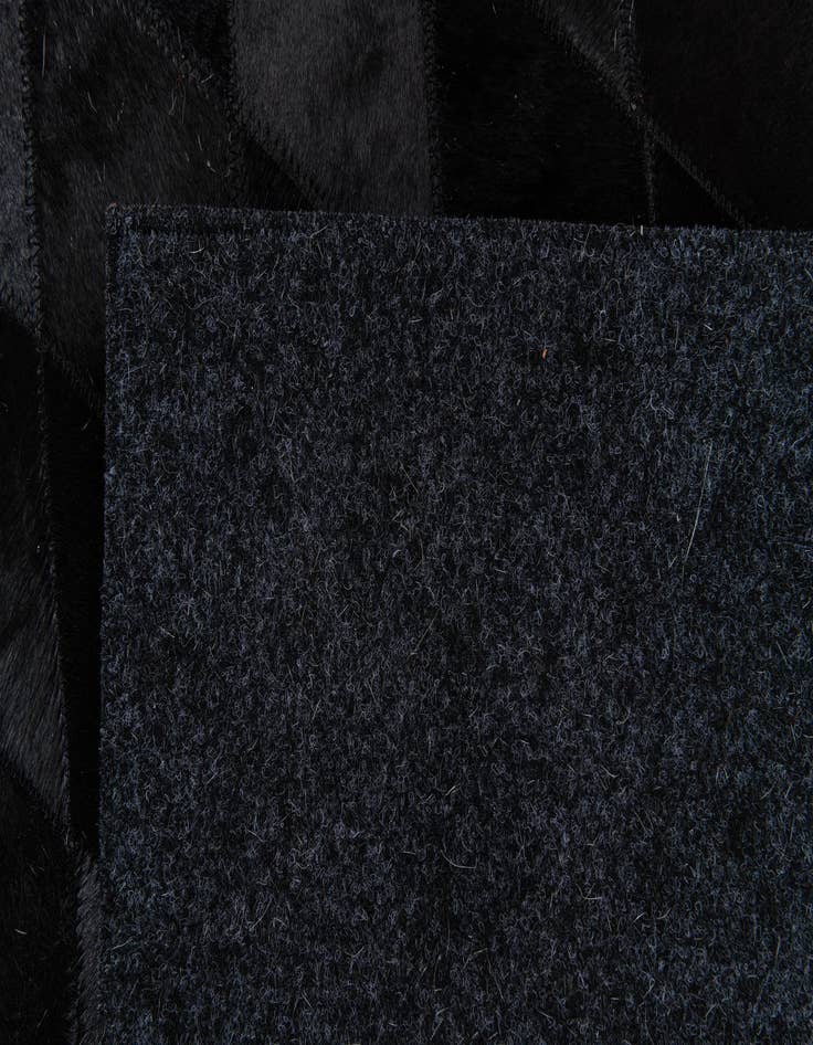 Detail image of  6' 5 x 9' 9 Cowhide Stocks Rug