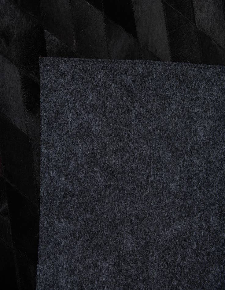 Detail image of  4' 7 x 6' 5 Cowhide Stocks Rug