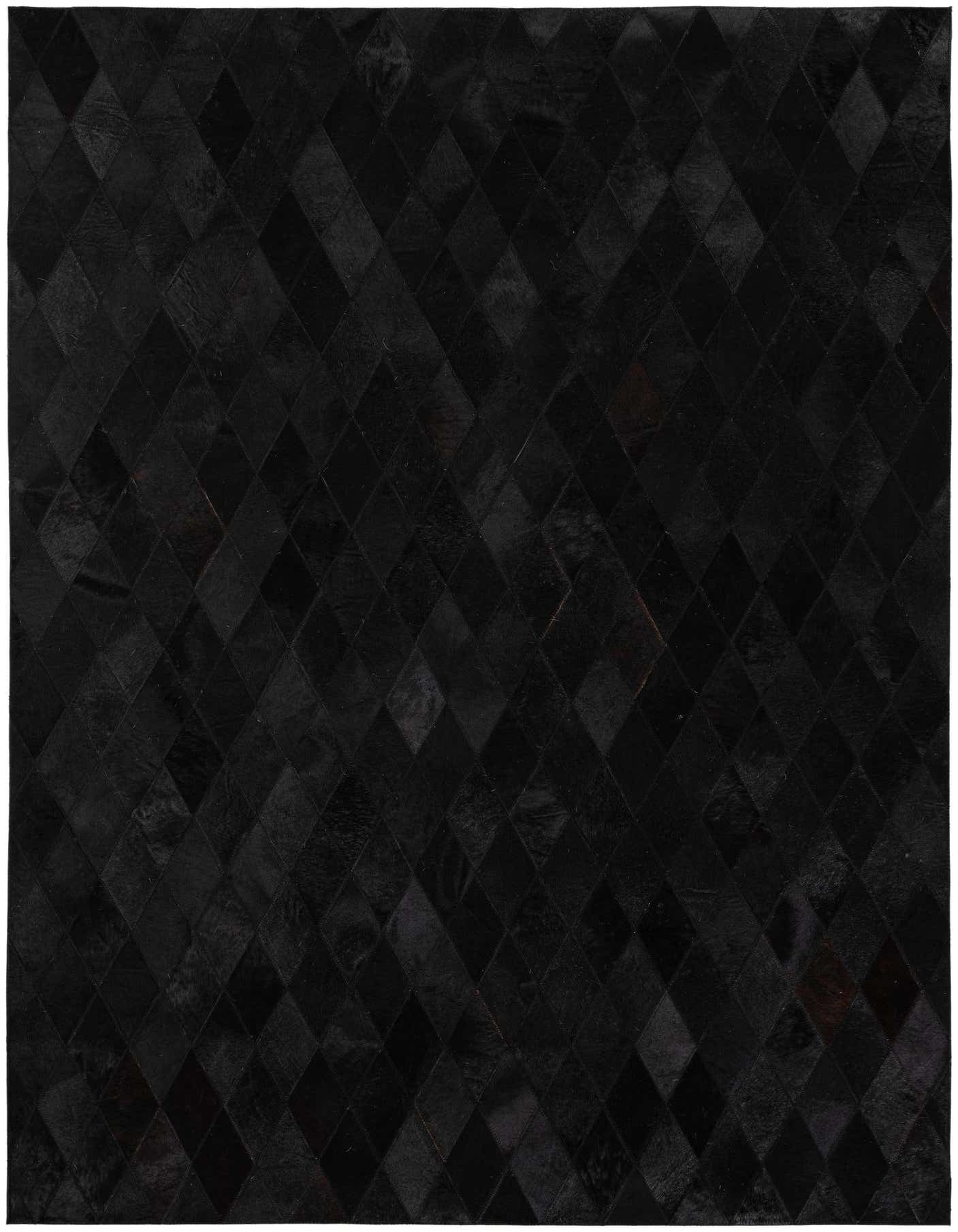 A 5x7 rectangular black cowhide rug featuring a modern diamond patchwork pattern, suitable for an indoor living space.