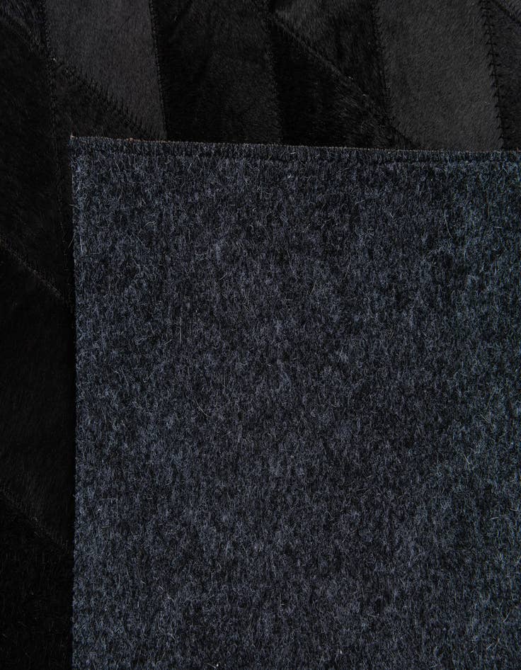 Detail image of  4' 7 x 6' 6 Cowhide Stocks Rug