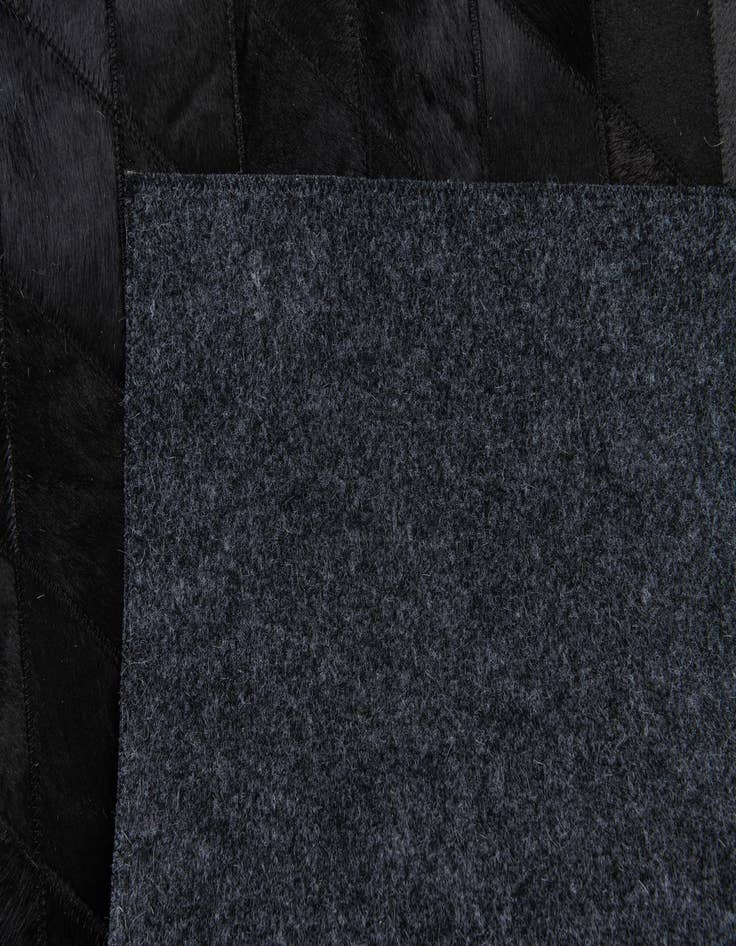 Detail image of  4' 7 x 6' 5 Cowhide Stocks Rug