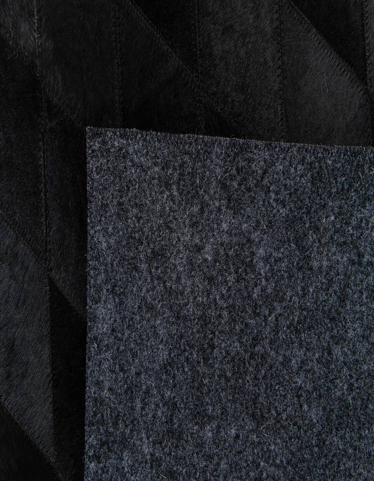 Detail image of  3' 11 x 5' 10 Cowhide Stocks Rug