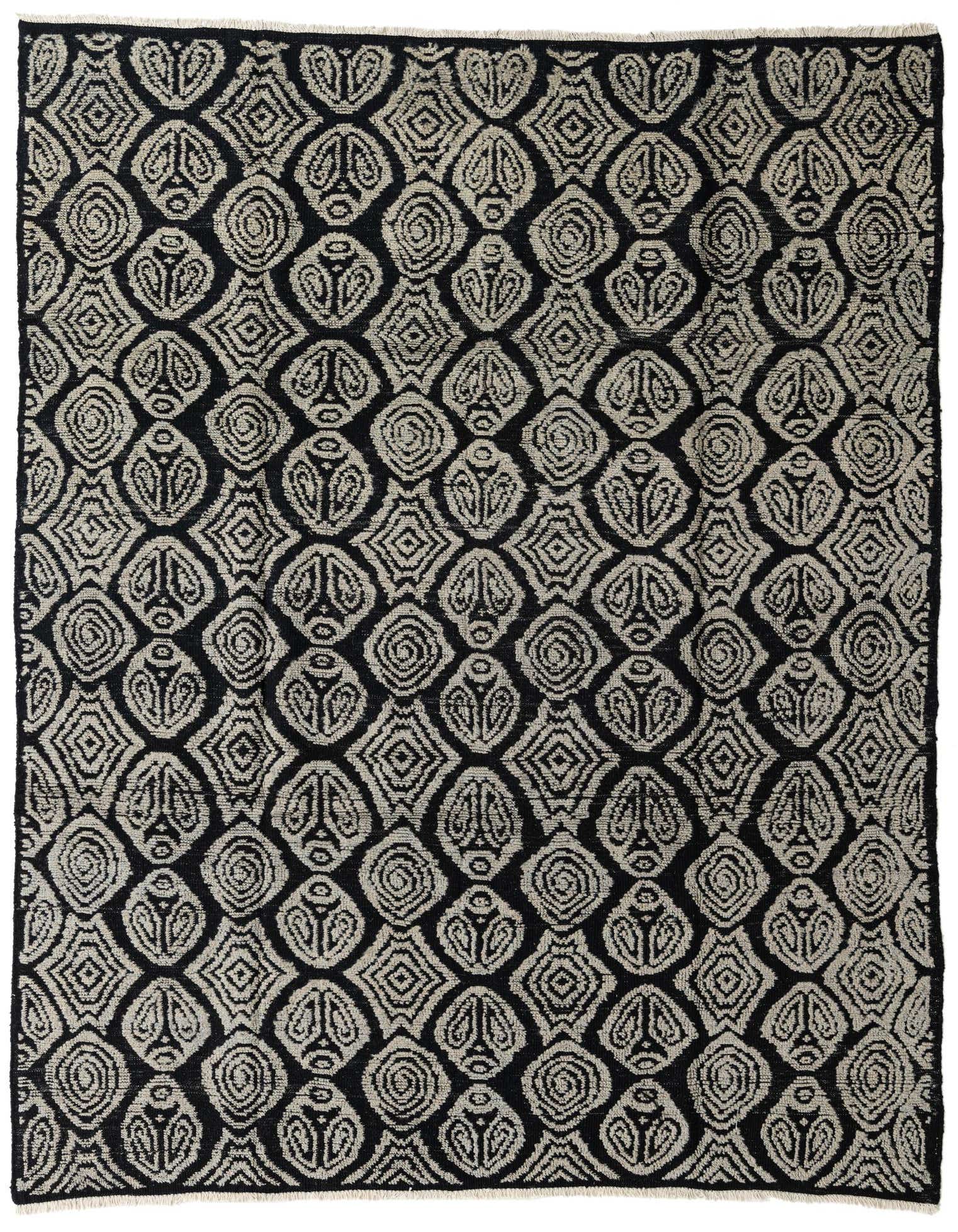 A rectangular 8x10 black and off-white wool rug with a modern abstract pattern, suitable for a living room.