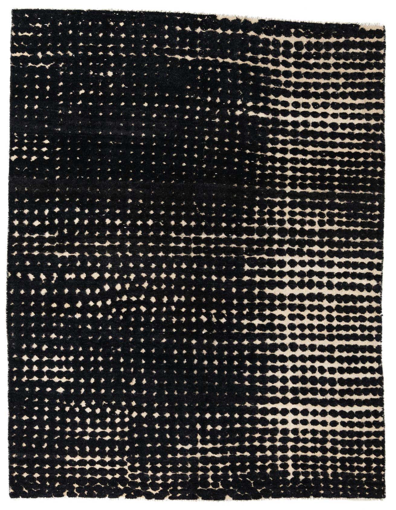 A 7x10 rectangular black and off-white modern abstract wool rug with a high pile and dot pattern.