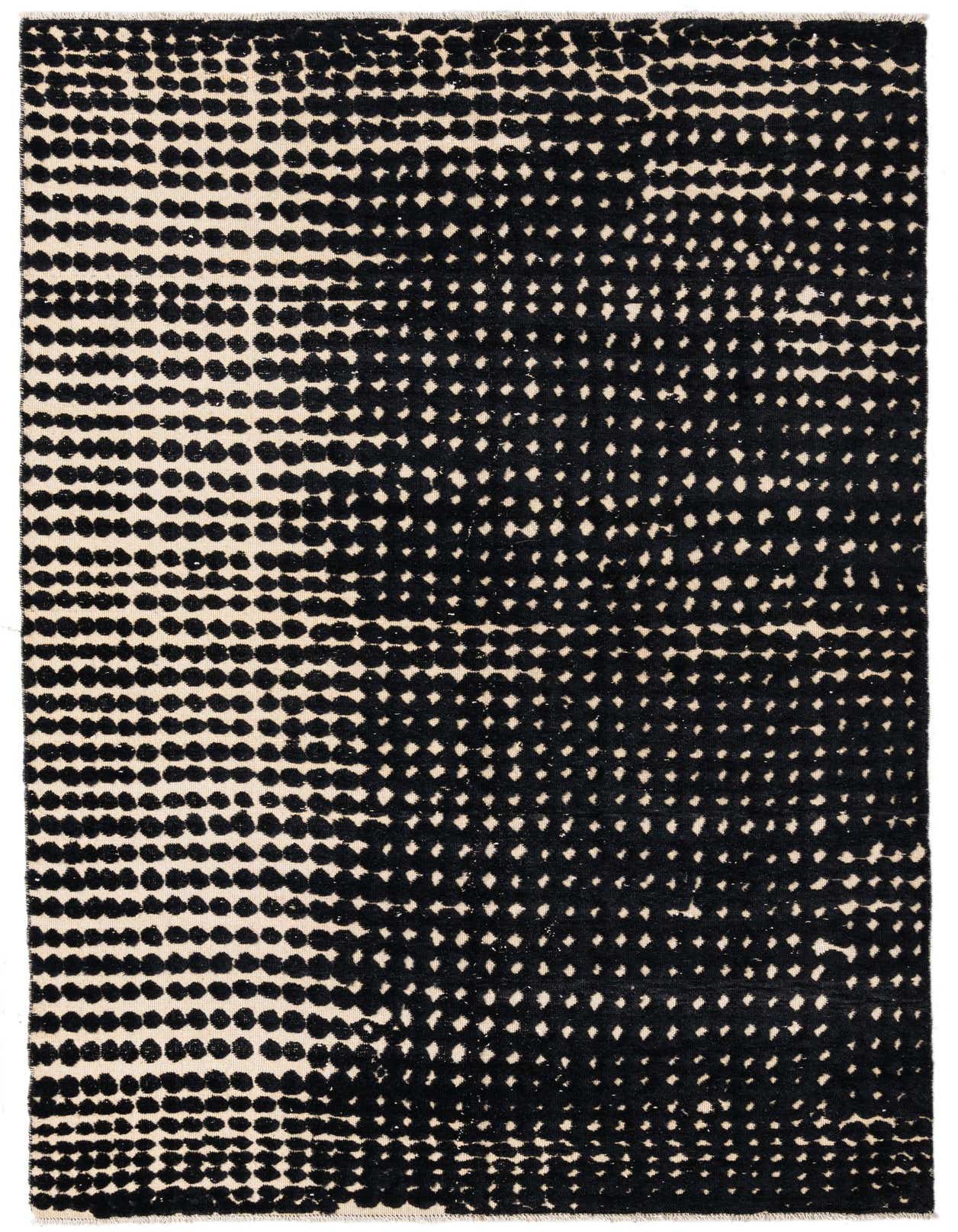 A 7x10 rectangular Darya rug with a modern black and cream dotted pattern, handmade from wool.