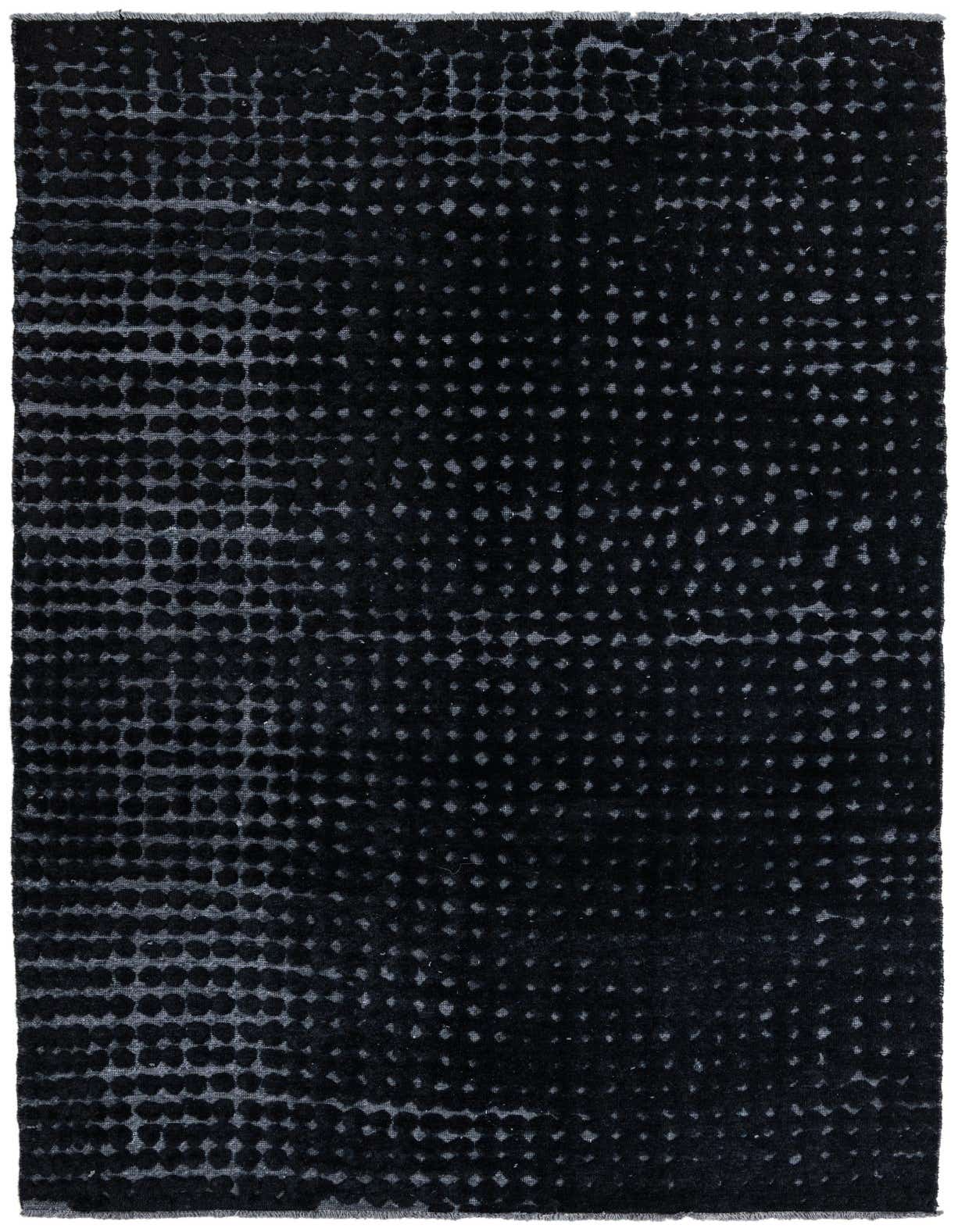 A 7x10 rectangular Darya rug in black wool, featuring a modern abstract dotted pattern with varying pile heights.