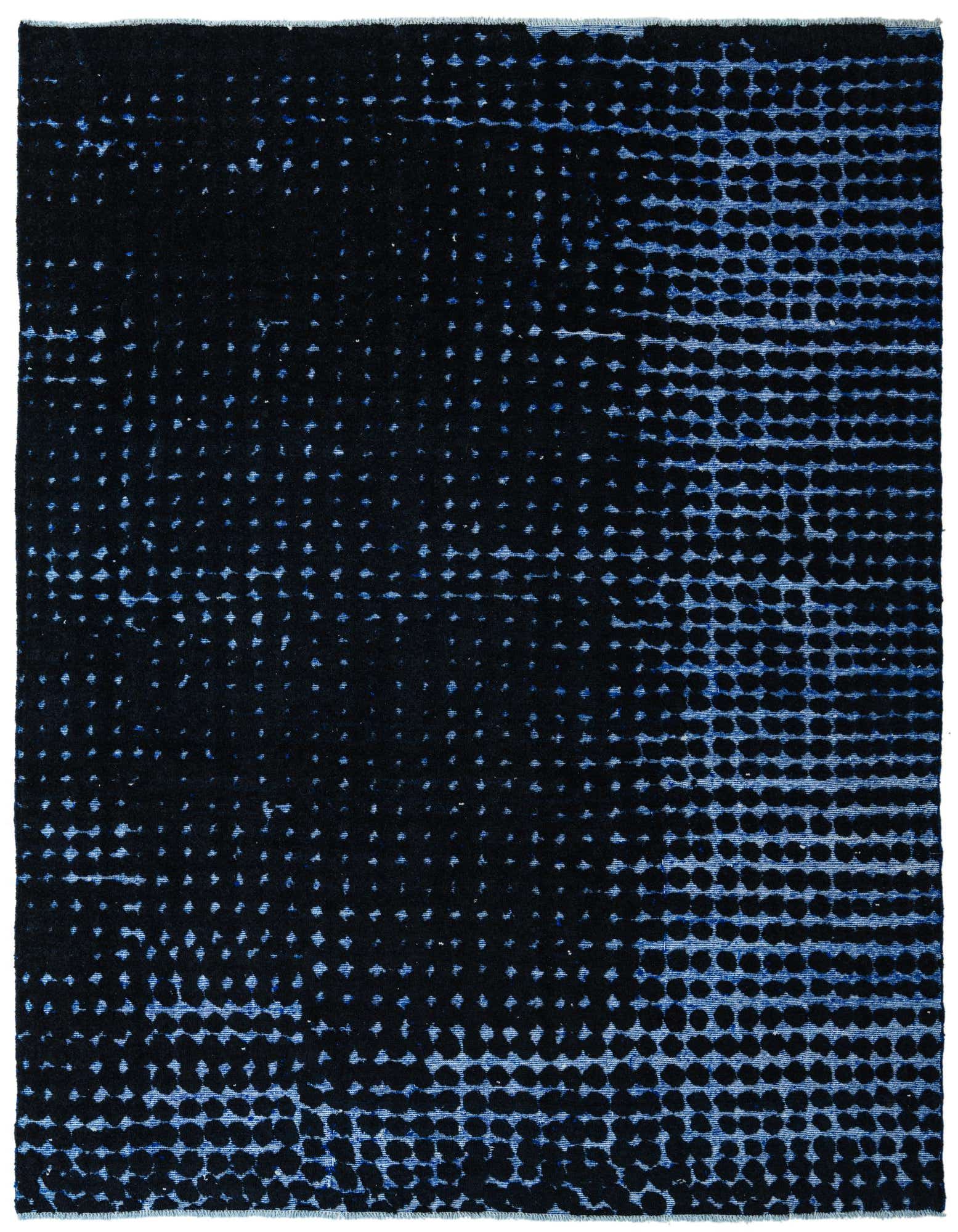 A rectangular 8x10 black wool rug with a modern abstract pattern of faded blue dots, ideal for a living room.