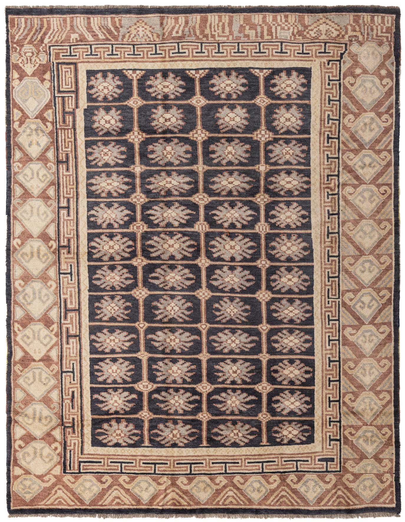 7x10 rectangular Darya rug featuring a central black field with repeating light floral motifs, framed by intricate geometric borders in brown and beige tones.