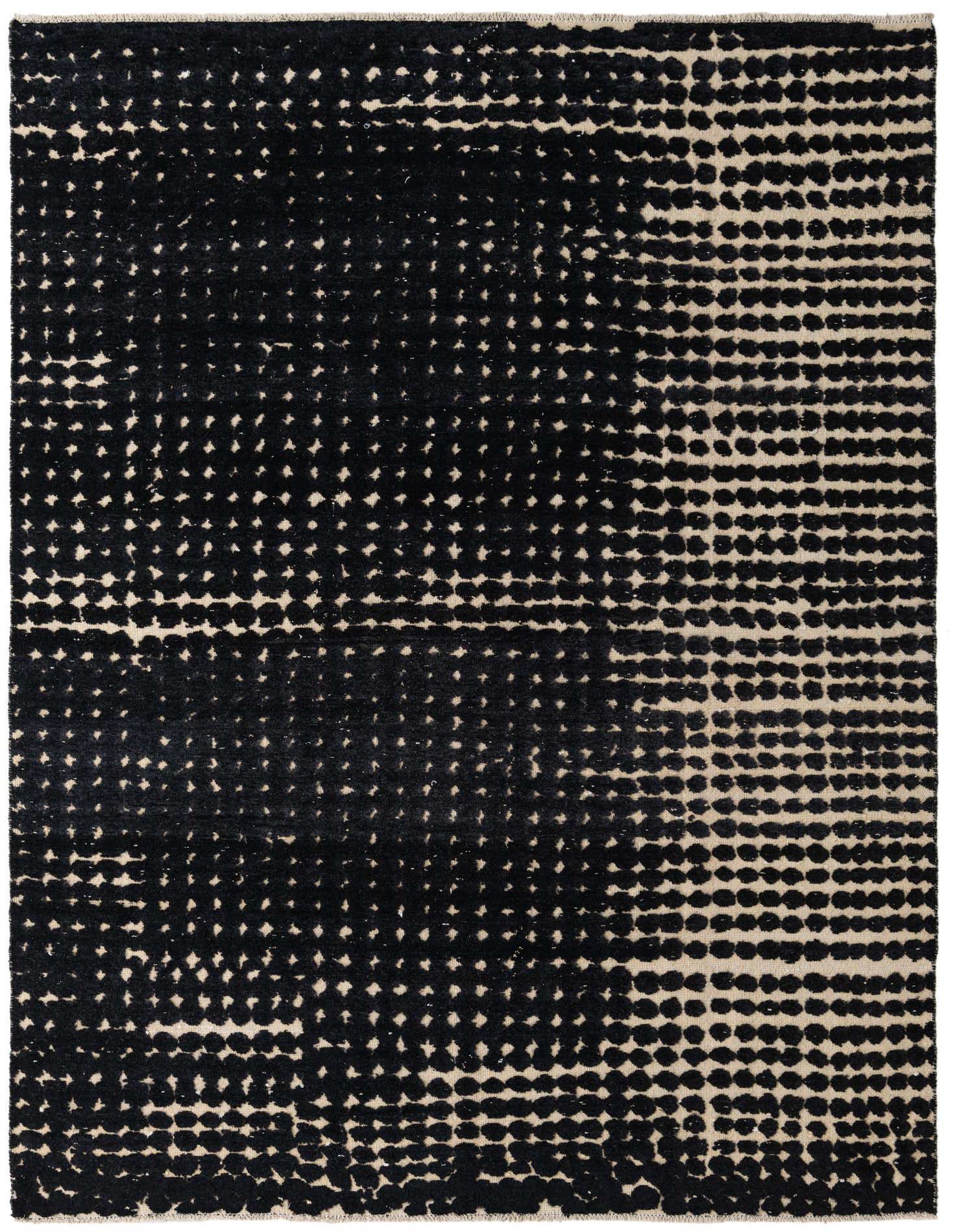 A rectangular 8x10 black and beige modern wool rug with an abstract dotted pattern, suitable for a living room.