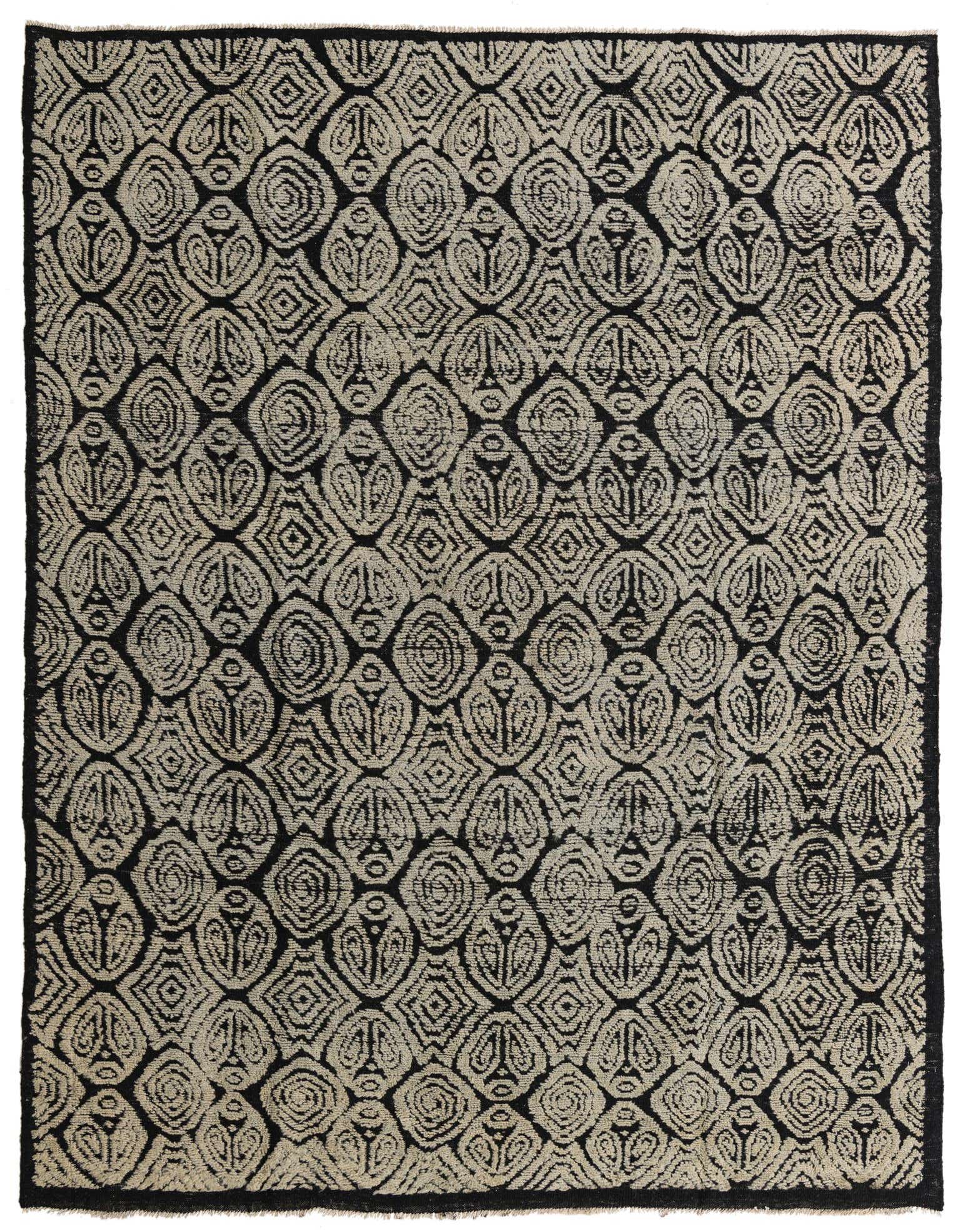 A rectangular 8x10 black and beige modern abstract wool rug with a high pile, featuring an intricate repeating pattern.