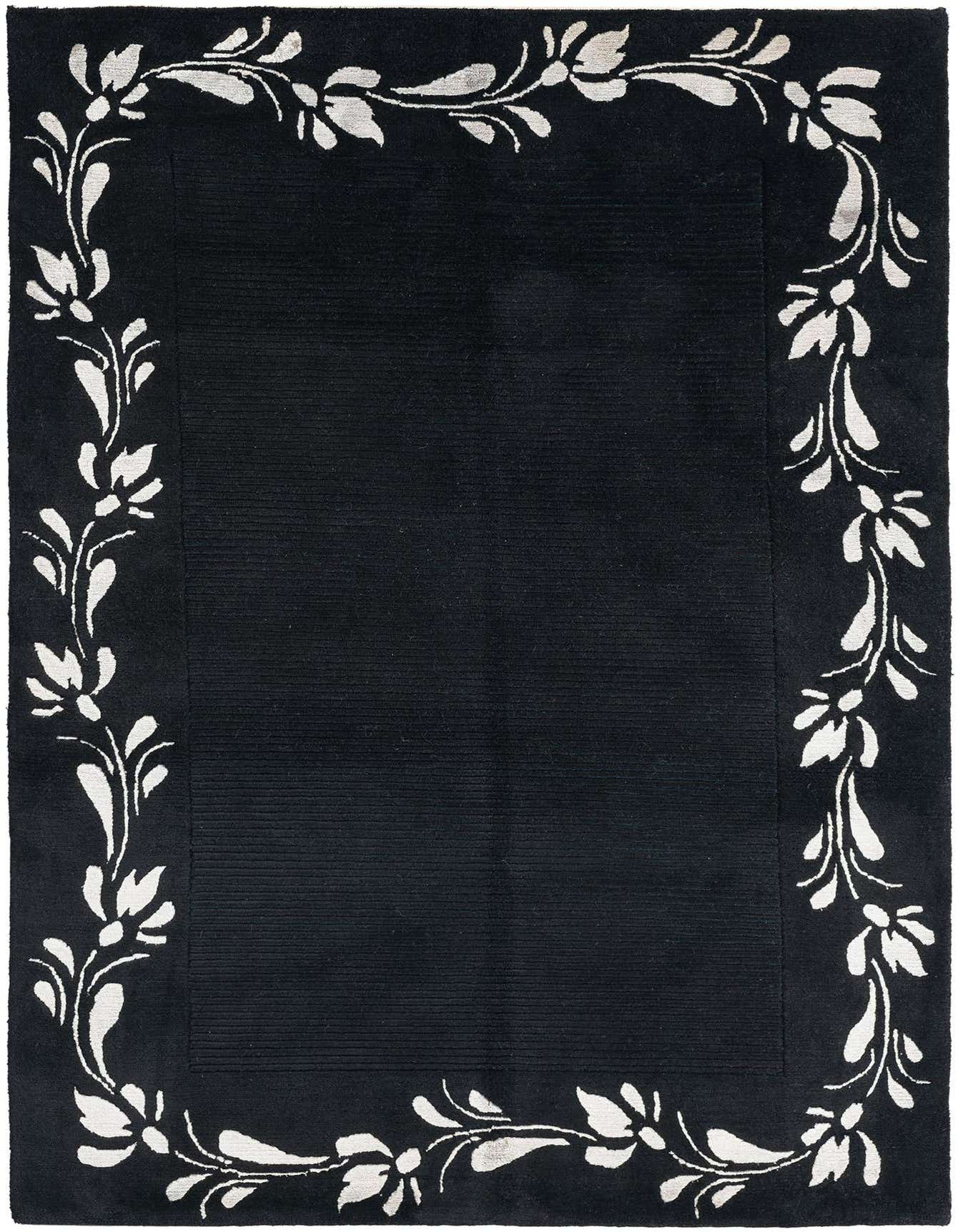 A 3x5 rectangular black wool and cotton rug with a high pile and a modern Persian floral border in white.