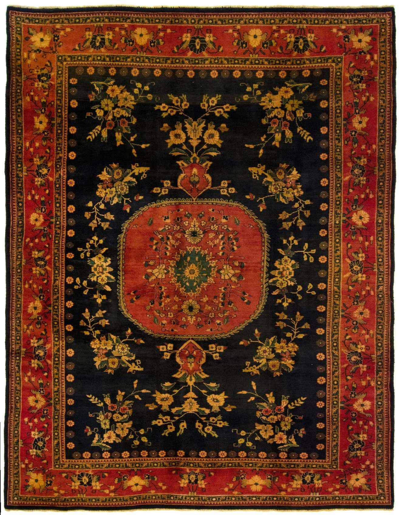 A 6x9 rectangular Ghom Persian rug with a black field, red border, and intricate floral patterns in gold and green.