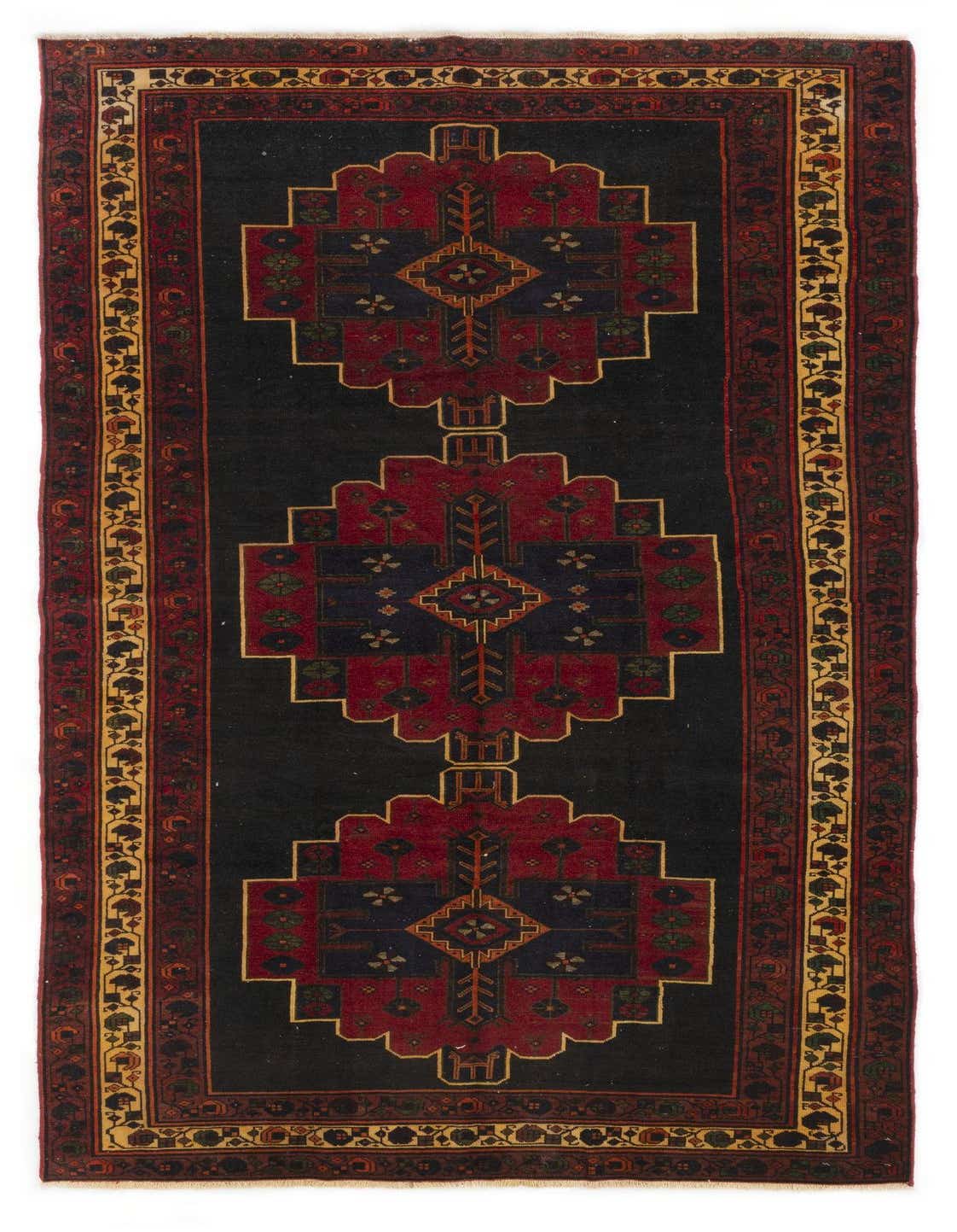 A 5x8 rectangular black Hamedan wool rug with a traditional Persian tribal pattern in deep red, navy, and gold.