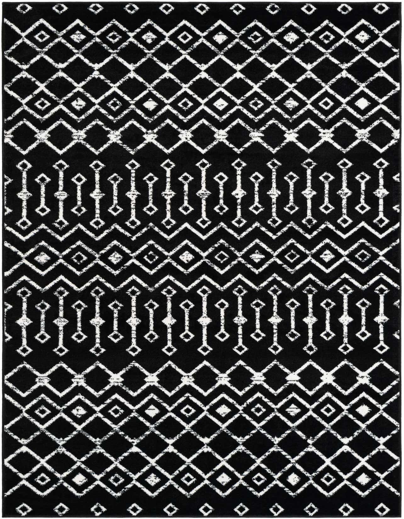 A 5x8 rectangular black rug with a distressed white tribal trellis pattern, featuring geometric diamonds and zigzags.