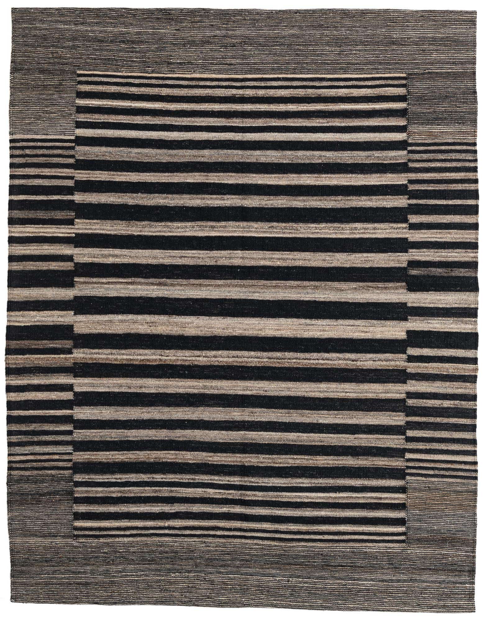 A 5x8 rectangular black and beige striped flatweave rug with a tribal border, ideal for a living room.