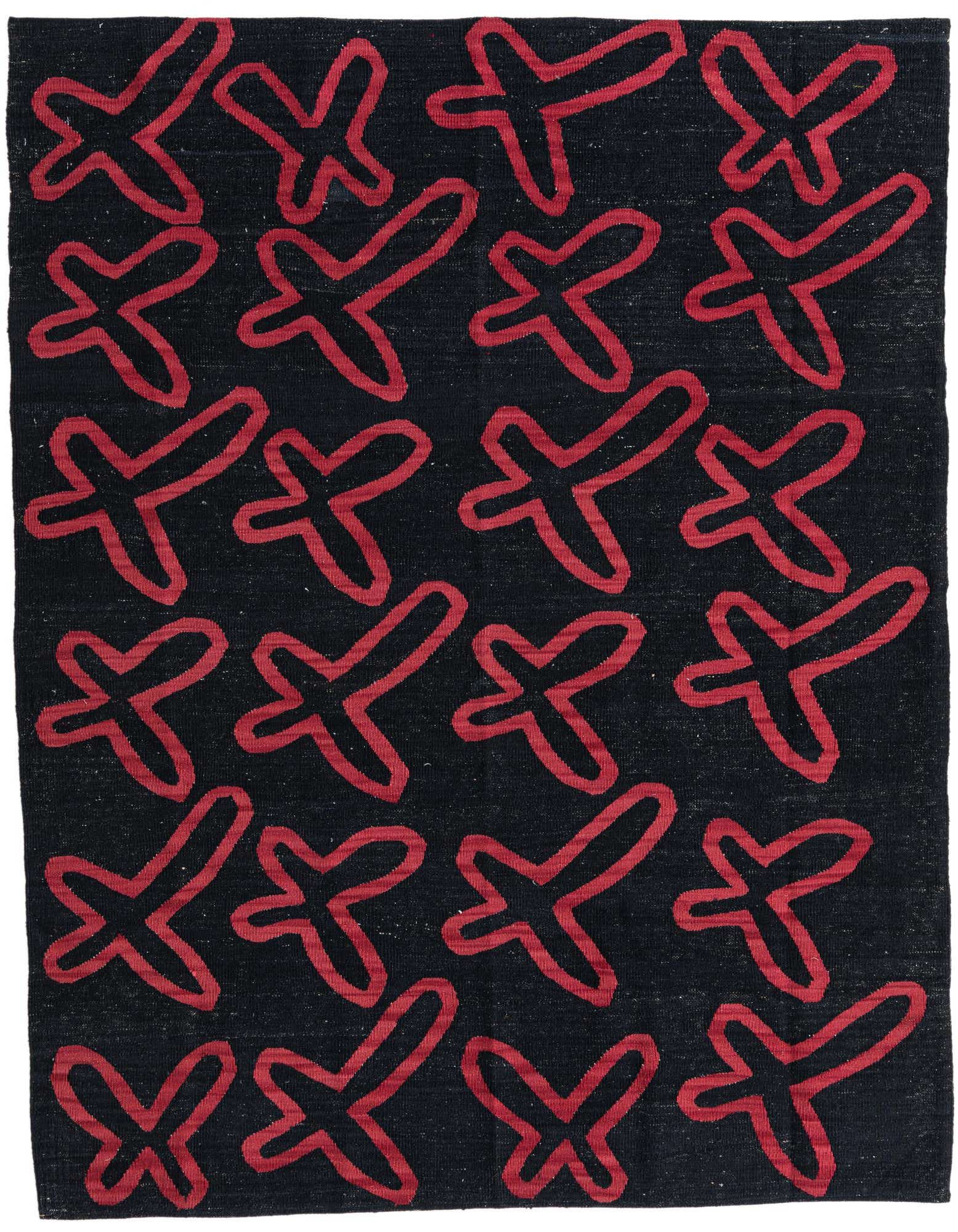 A 5x8 rectangular black flatweave wool rug with a repeating pattern of bold, abstract red X-shapes, ideal for a modern living room.