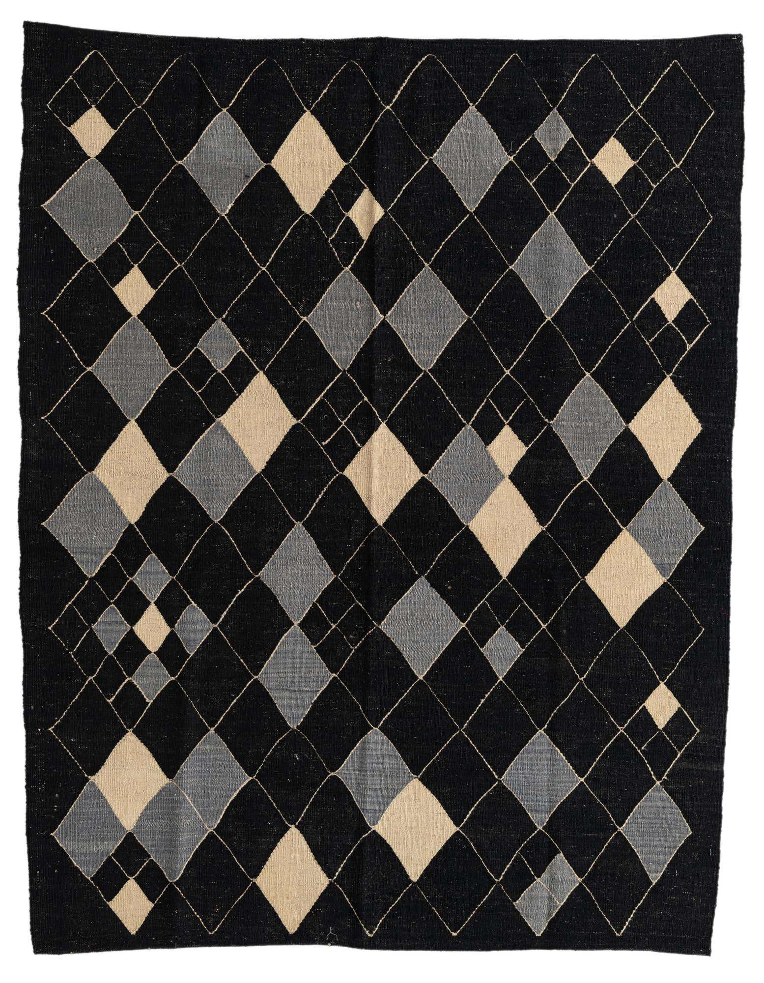 A 5x8 rectangular black flatweave wool rug with an abstract tribal diamond pattern in varying shades of black, grey, and beige.