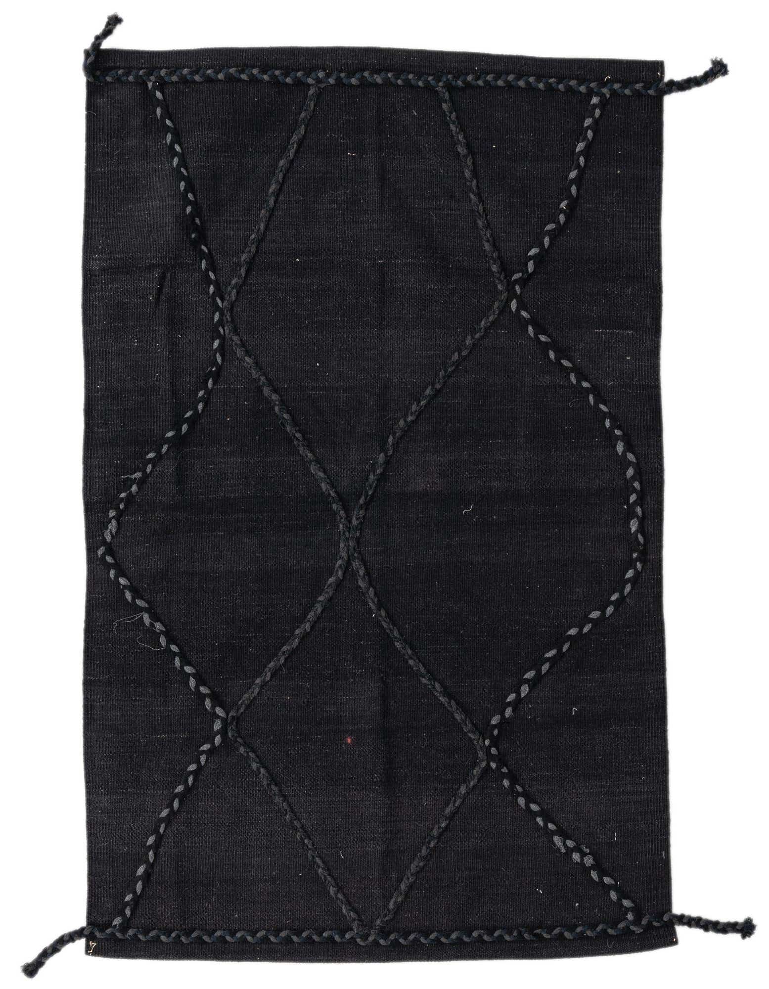 A 3x5 rectangular black wool flatweave rug with a subtle tribal geometric pattern formed by braided lines.