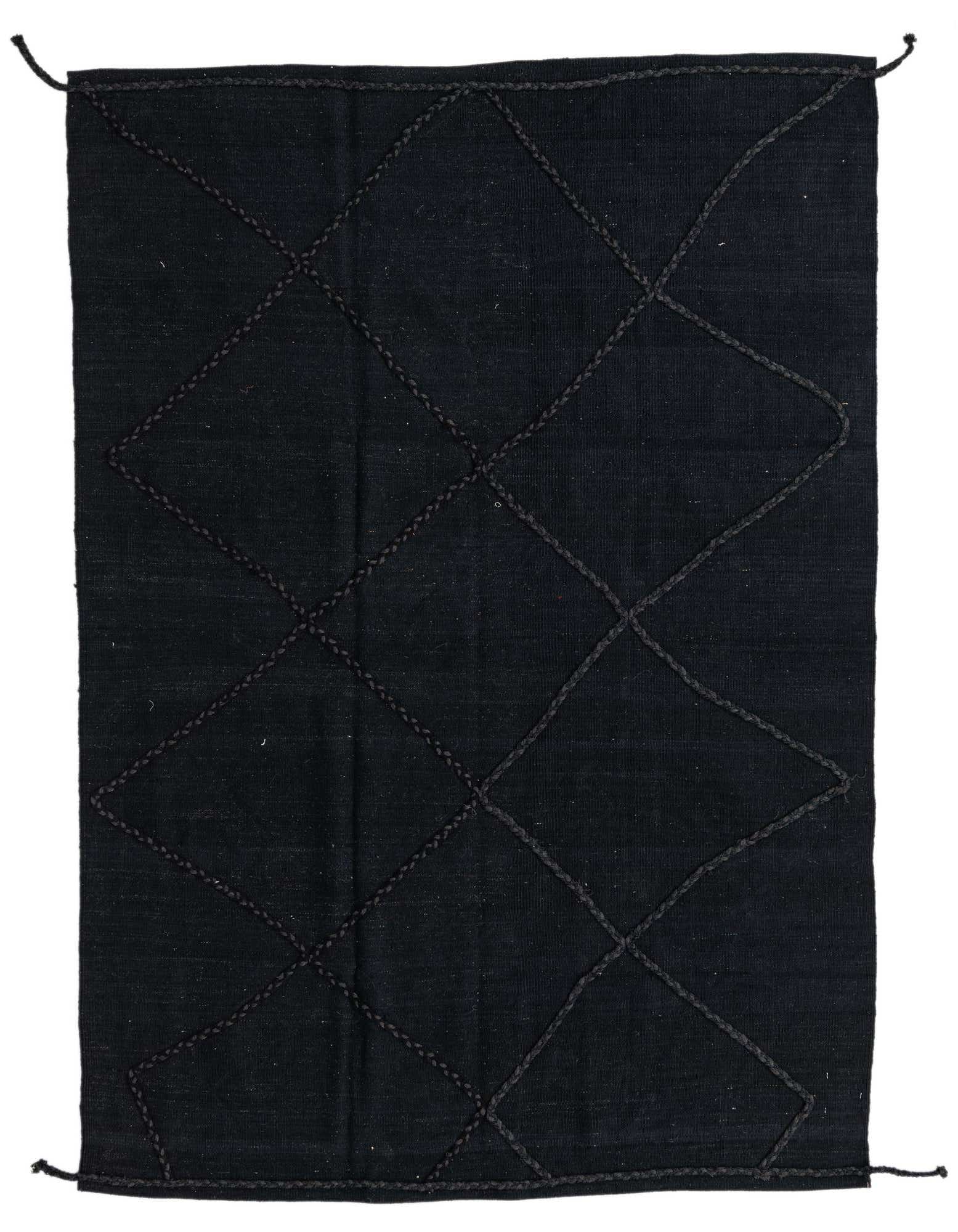 A 5x8 rectangular black flatweave wool rug with a subtle tribal diamond pattern, ideal for a modern living room.