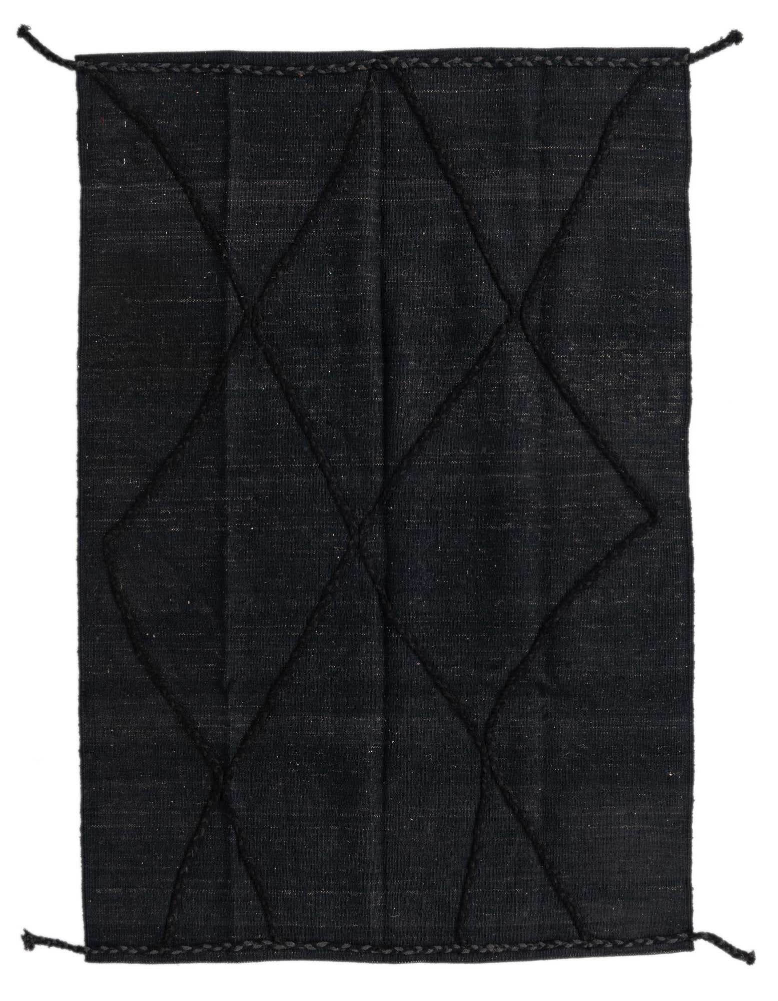 A 4x6 rectangular black wool flatweave rug with a subtle tribal diamond pattern, ideal for a modern living room.