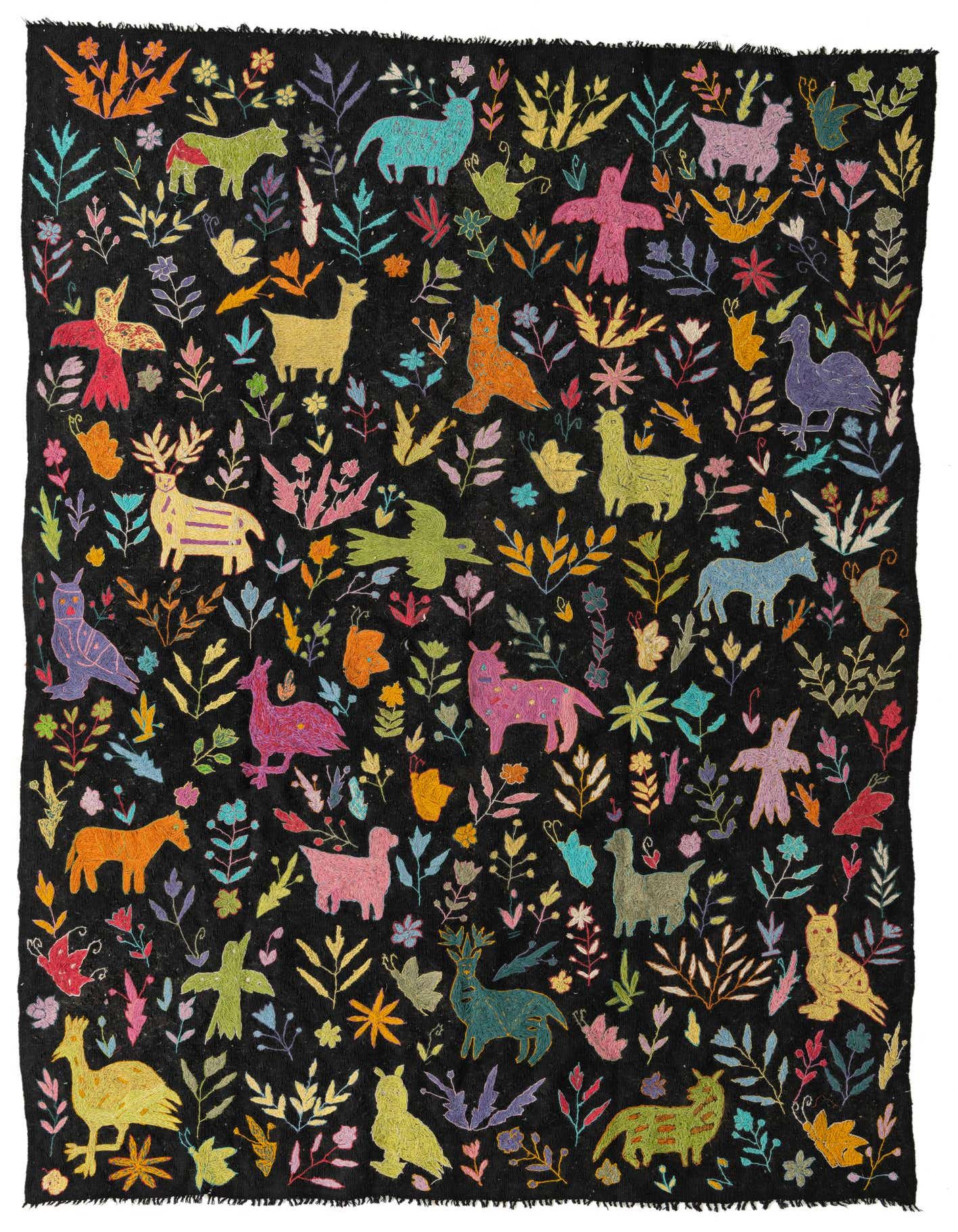 A 6x9 rectangular black rug with a vibrant, colorful tribal pattern of animals, birds, and botanical motifs.