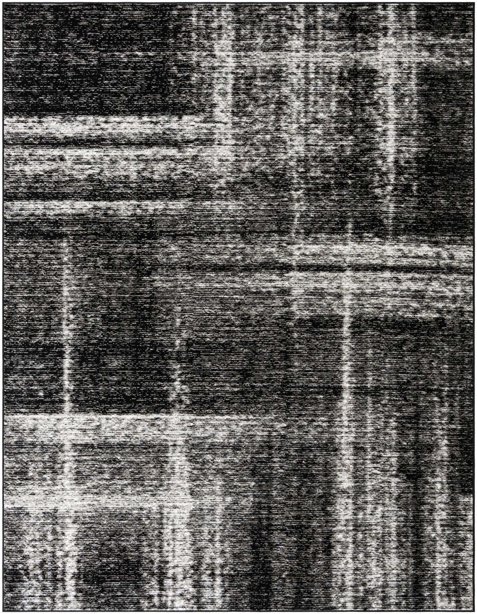 A 9x12 rectangular black area rug with a distressed, abstract pattern featuring varying shades of black and dark gray.