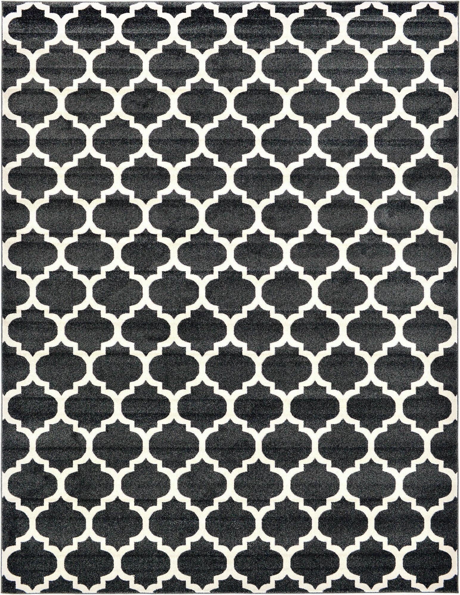 A 10x13 rectangular black area rug featuring a repeating white modern trellis pattern, suitable for a living room.