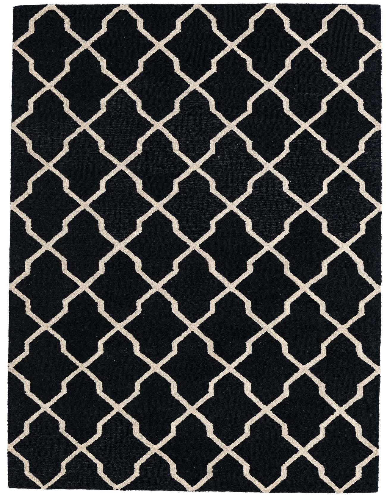 A 5x8 rectangular Luna collection rug featuring a bold black background with an interlocking off-white geometric trellis pattern.
