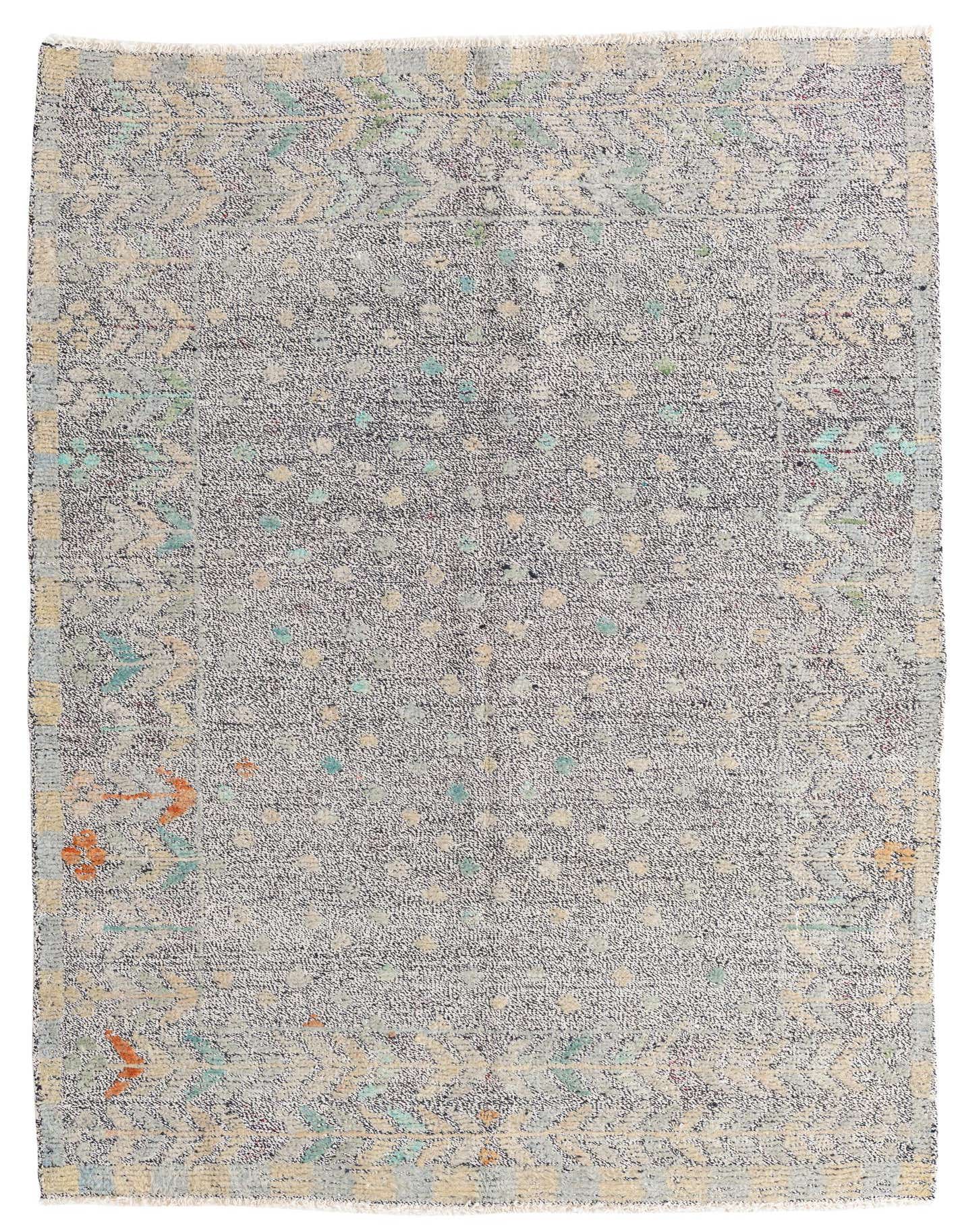 A rectangular 5x7 black Modern Ziegler wool rug with a subtle Southwestern pattern in muted teal, orange, and cream.