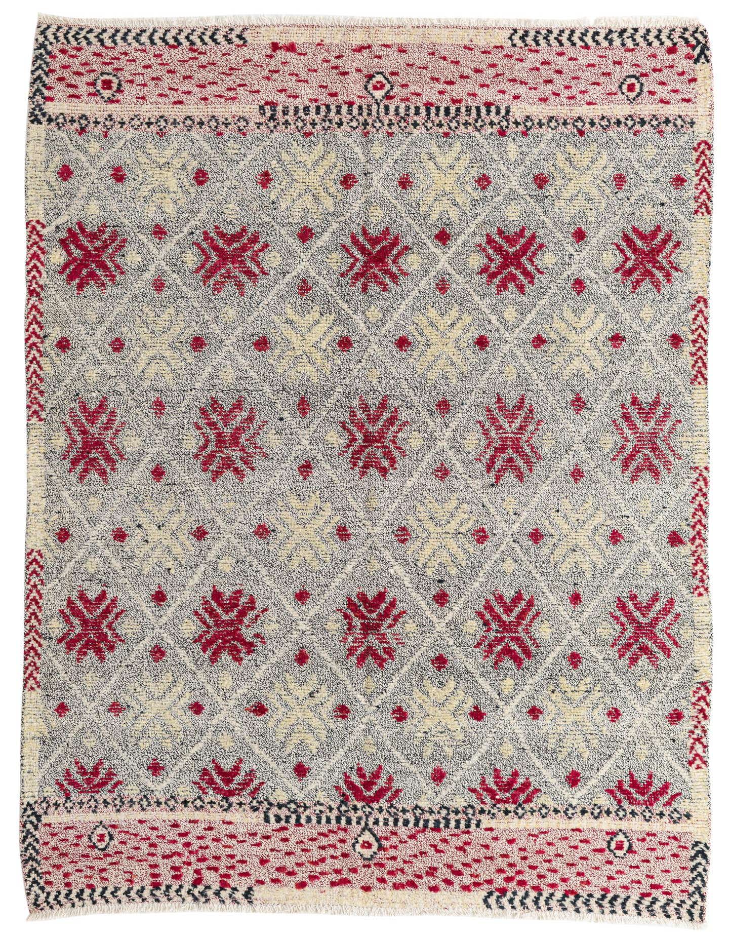 A 6x9 rectangular Modern Ziegler wool rug featuring a black, red, and cream Southwestern pattern with geometric motifs and a decorative border.