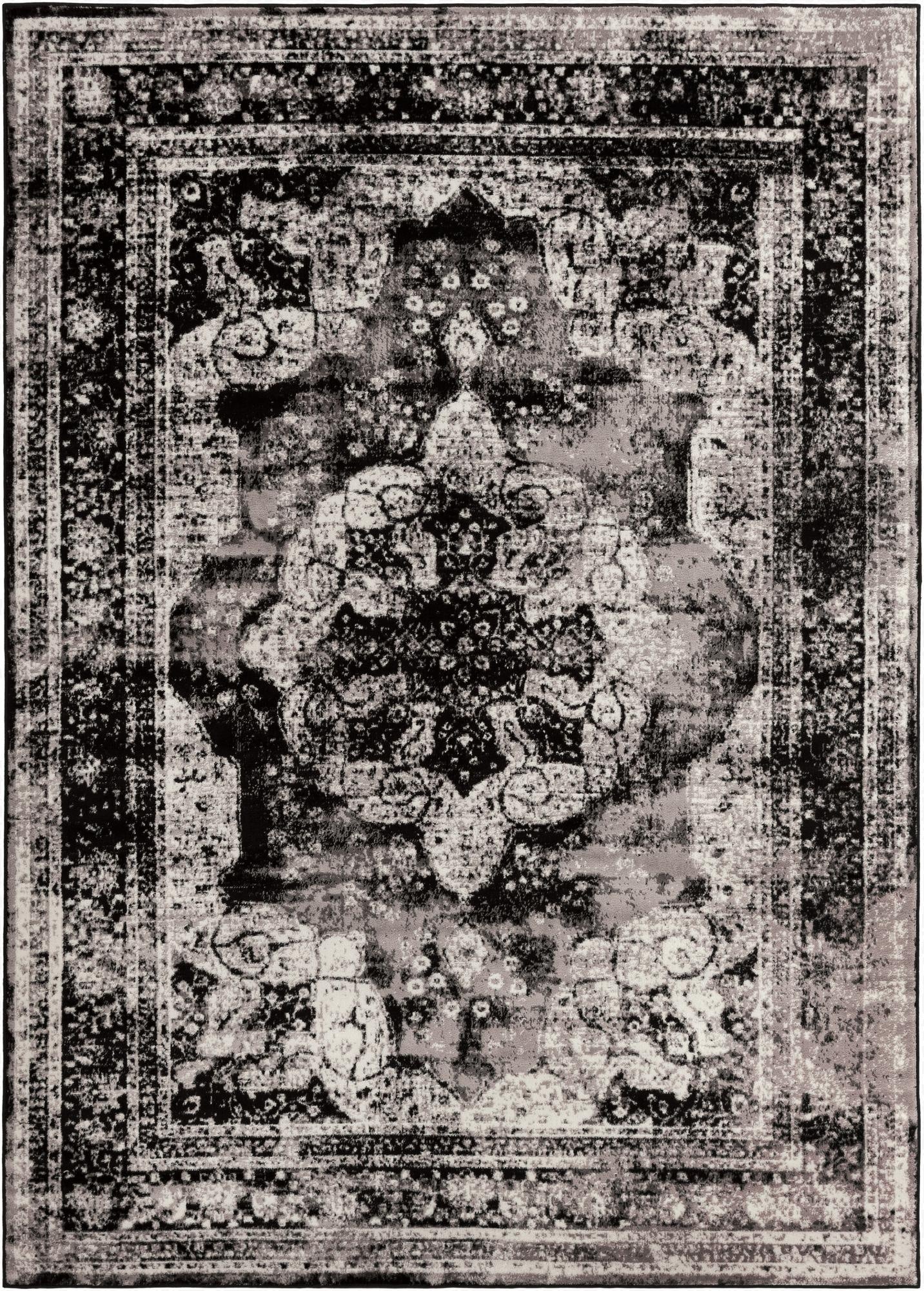 A rectangular 8x11 black and white distressed Bohemian rug with a central medallion and ornate border.