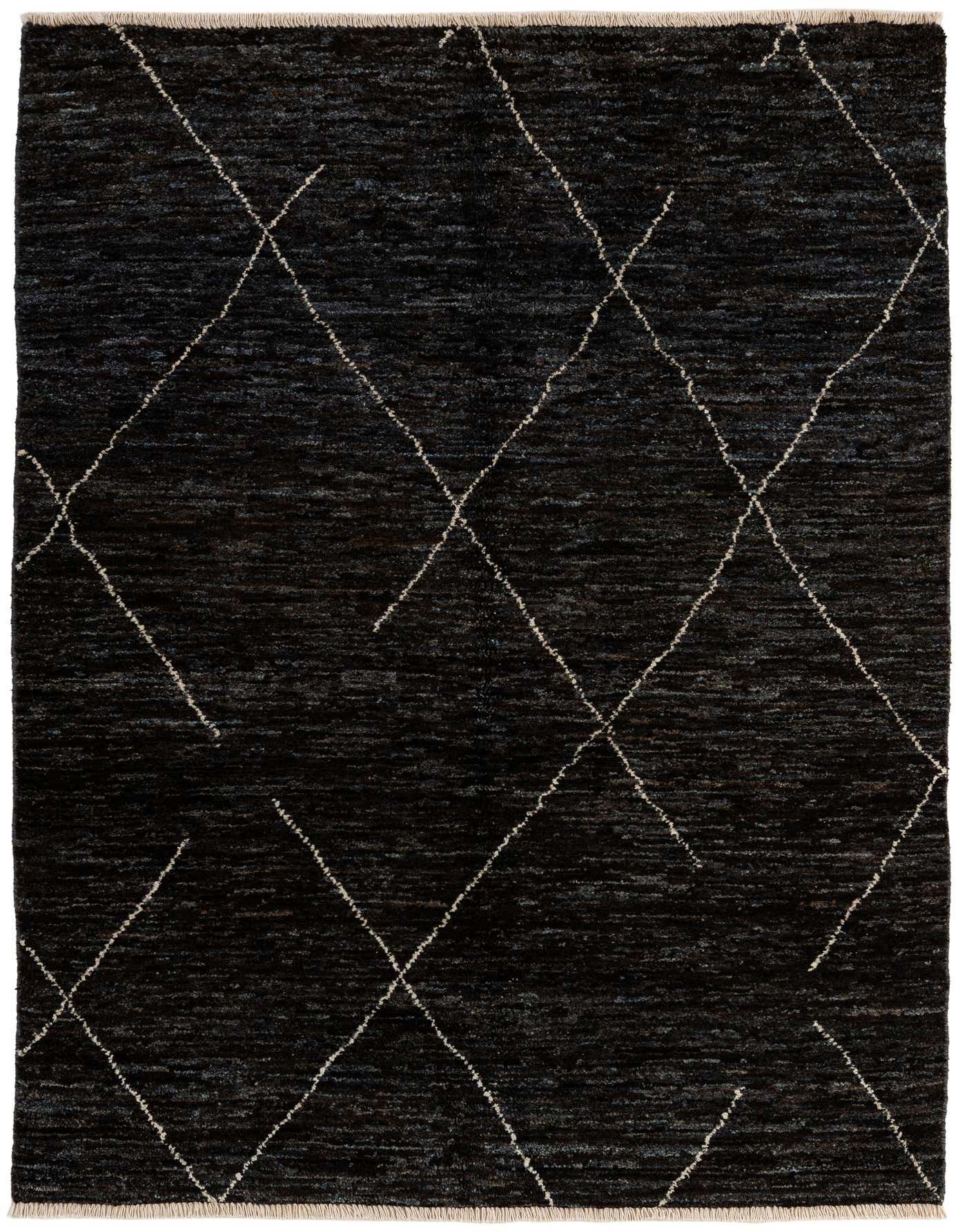 A 4x6 rectangular black wool rug with a subtle tribal diamond pattern in off-white, suitable for a living room.