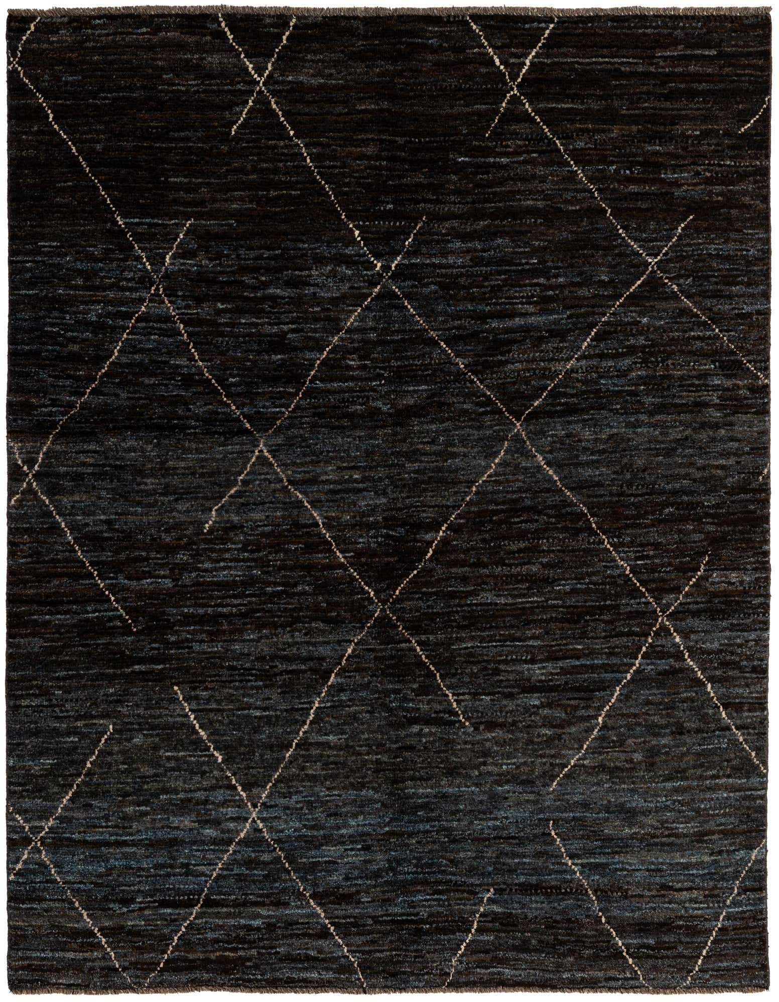 A 5x7 rectangular black wool rug with a subtle tribal diamond pattern in lighter threads, suitable for indoor use.
