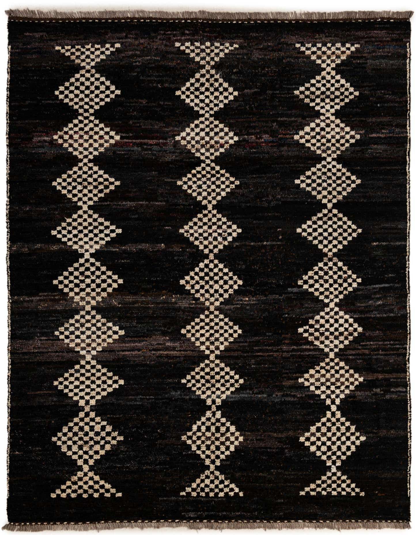 A 6x9 rectangular black wool rug with three vertical columns of cream-colored, checkered diamond patterns, ideal for a living room.
