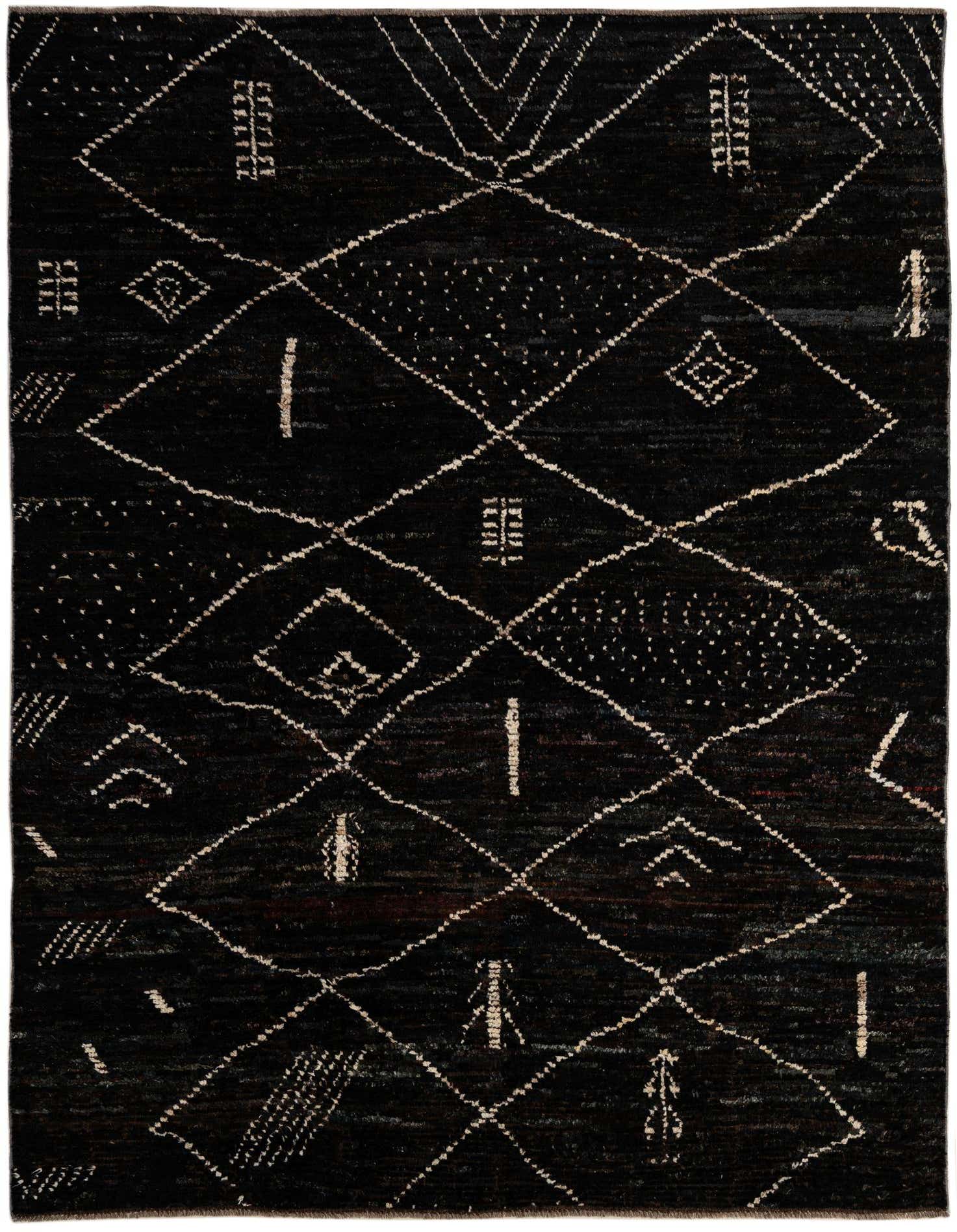 A 6x9 rectangular black wool rug with a tribal modern pattern of white geometric diamonds and abstract symbols.