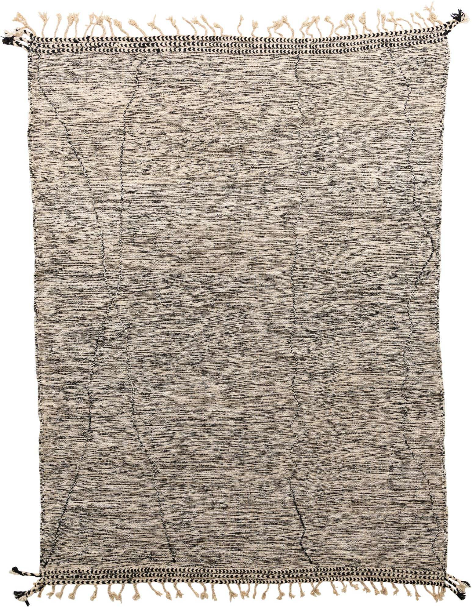 A 10x13 rectangular black and cream tribal wool shag rug with decorative fringe, suitable for a living room.