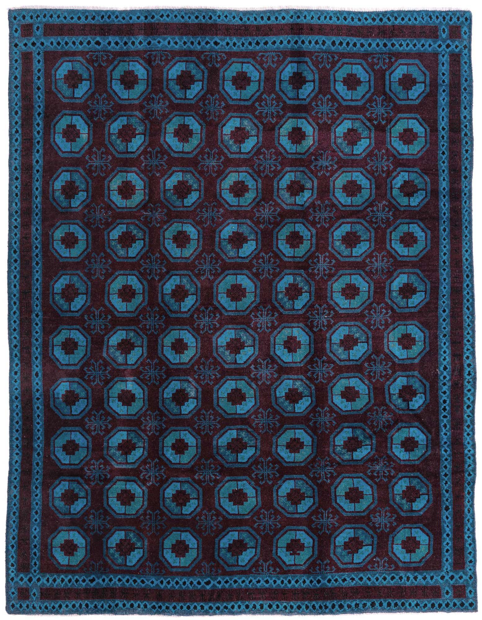 A rectangular 8x10 black and teal tribal rug with a modern geometric pattern and shag pile.
