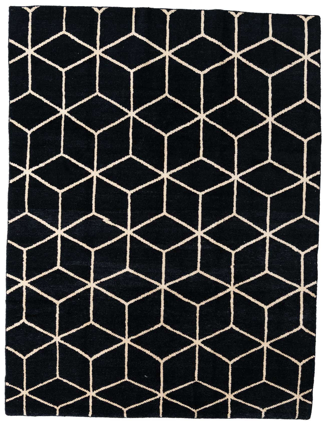A 7x10 rectangular black shag rug with a repeating off-white geometric cube pattern, perfect for a modern living room.