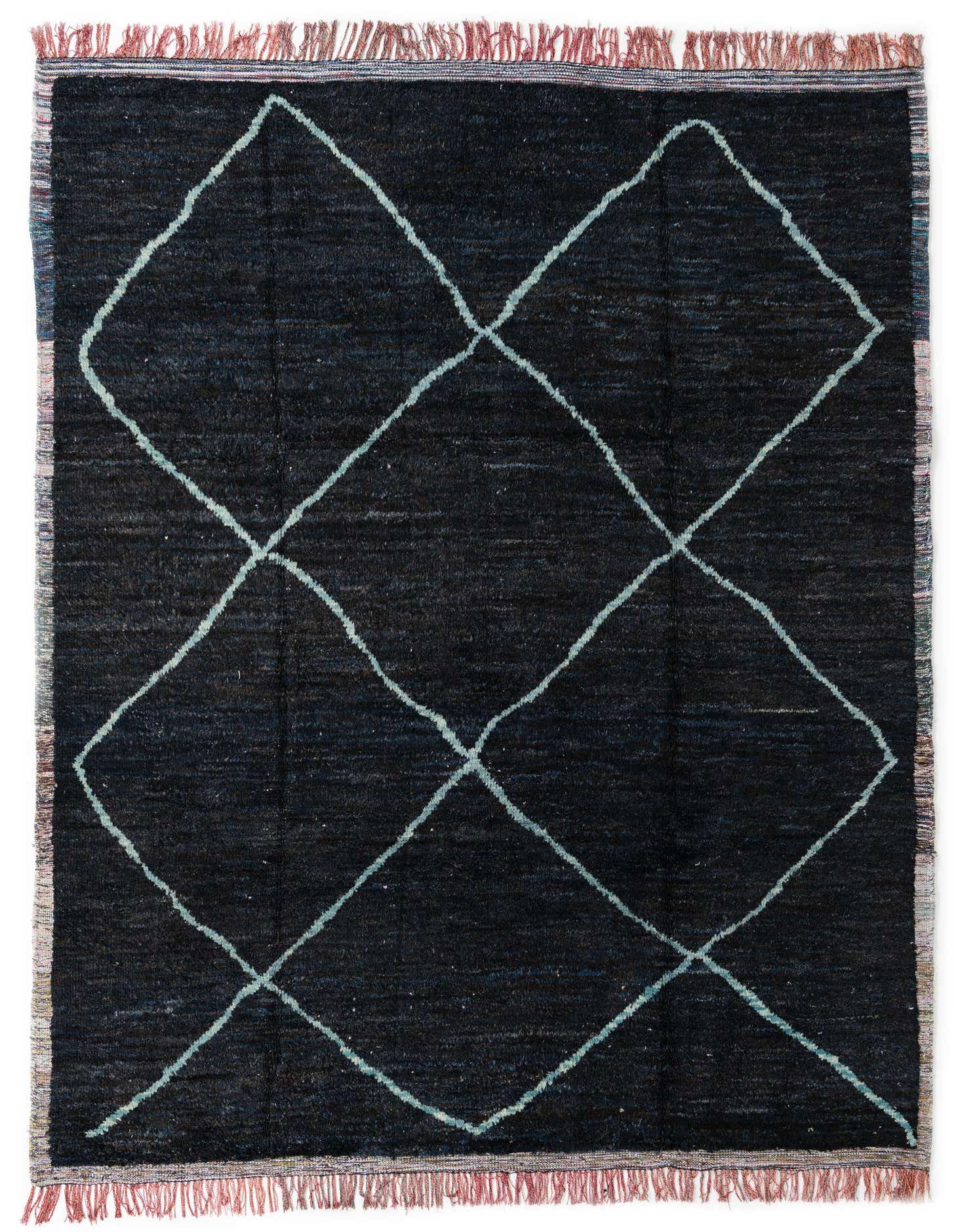 A 9x12 rectangular black shag rug with a light blue diamond tribal pattern and fringed edges.